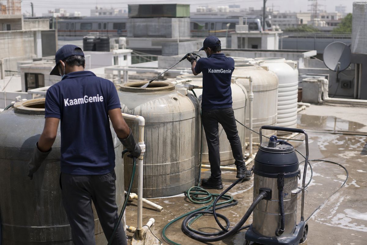 KaamGenie crew cleaning a society water tank in Maurya Enclave, Delhi