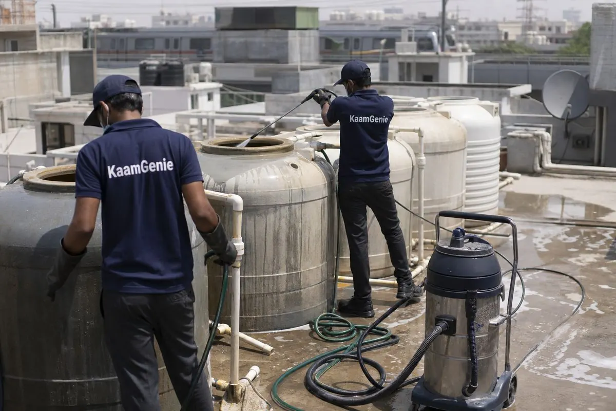KaamGenie crew cleaning a society water tank in Maurya Enclave, Delhi