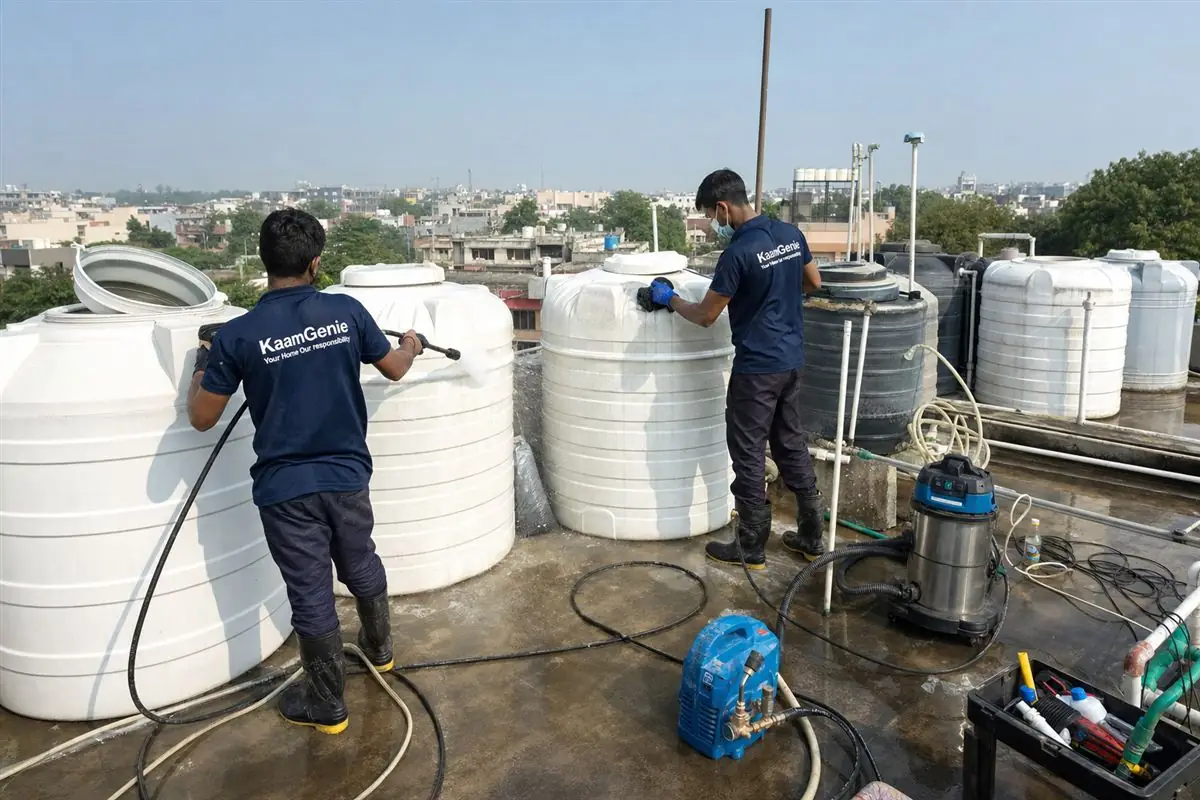 KaamGenie crew cleaning a society water tank in Mehrauli, Delhi