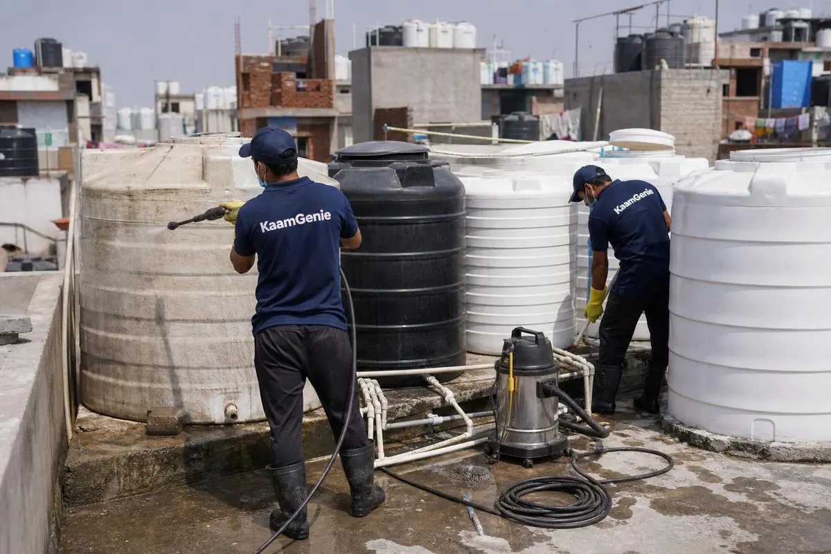 KaamGenie crew cleaning a society water tank in Mohan Garden, Delhi