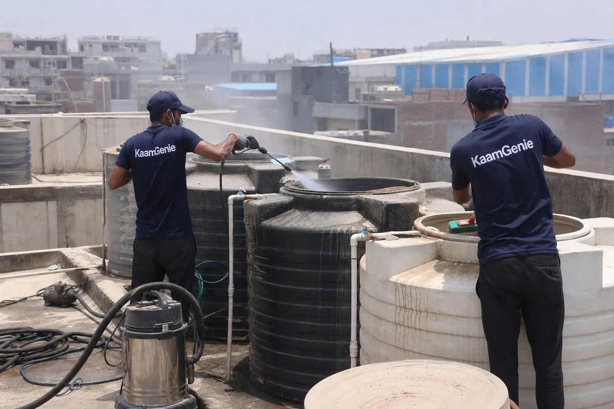 KaamGenie crew cleaning a society water tank in Mundka, Delhi