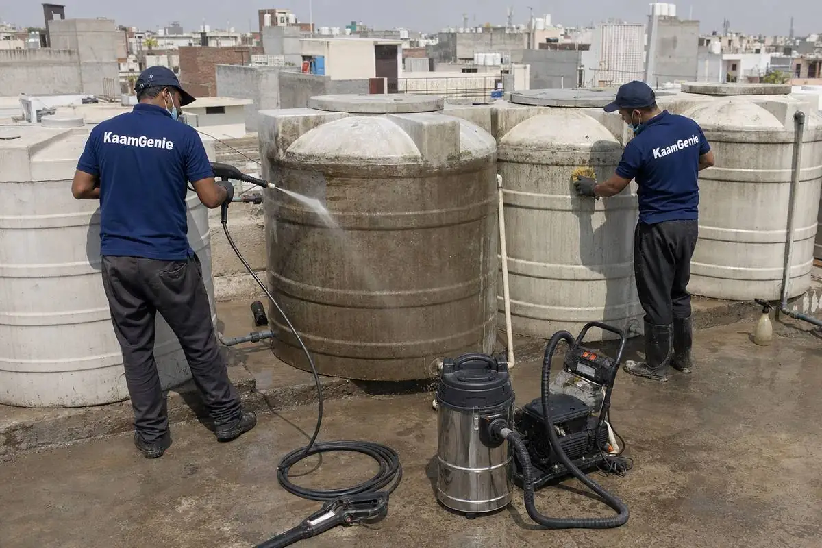 KaamGenie crew cleaning a society water tank in Najafgarh, Delhi