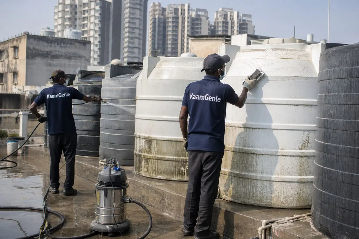 KaamGenie crew cleaning a society water tank in Netaji Nagar, Delhi