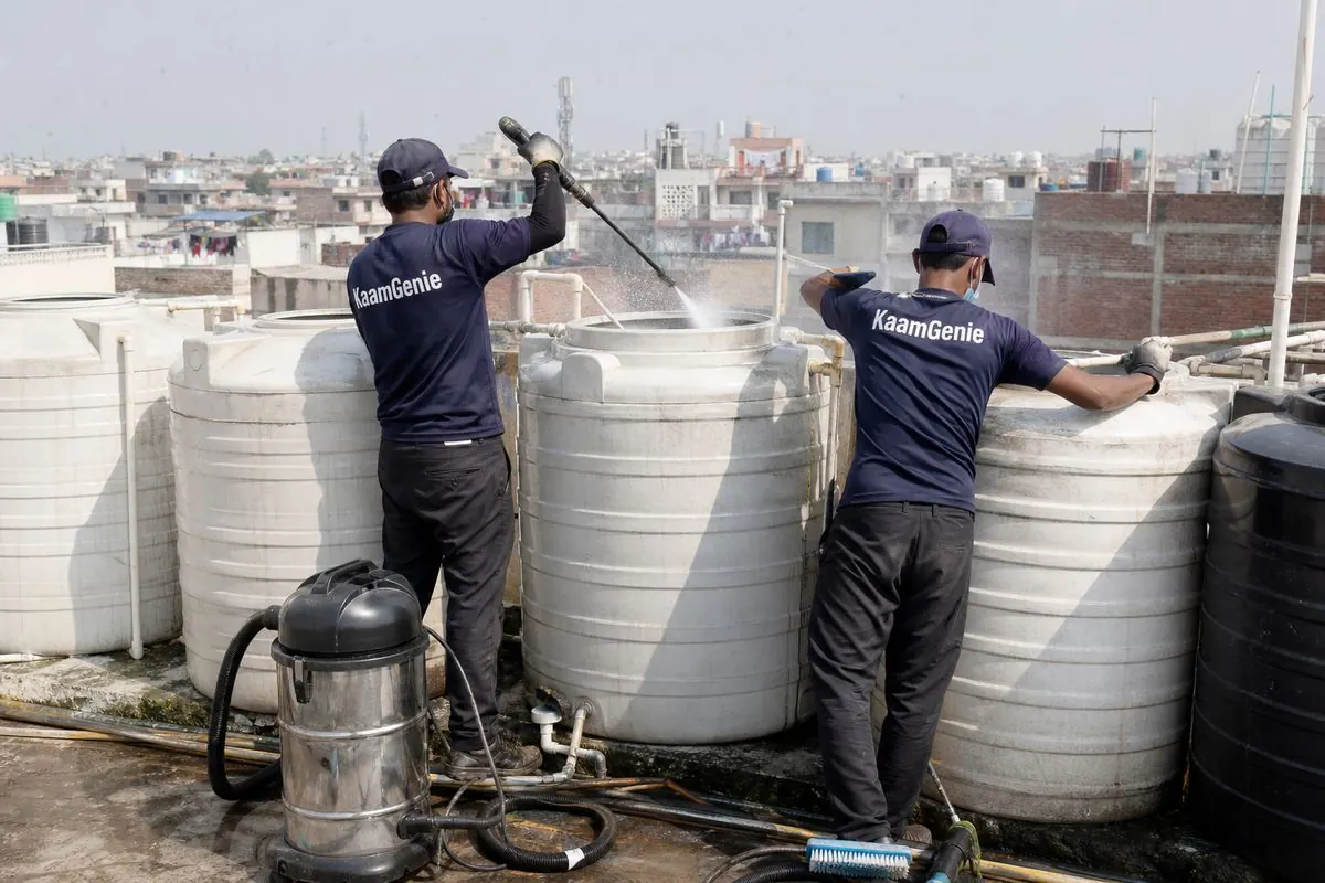 KaamGenie crew cleaning a society water tank in New Usmanpur, Delhi