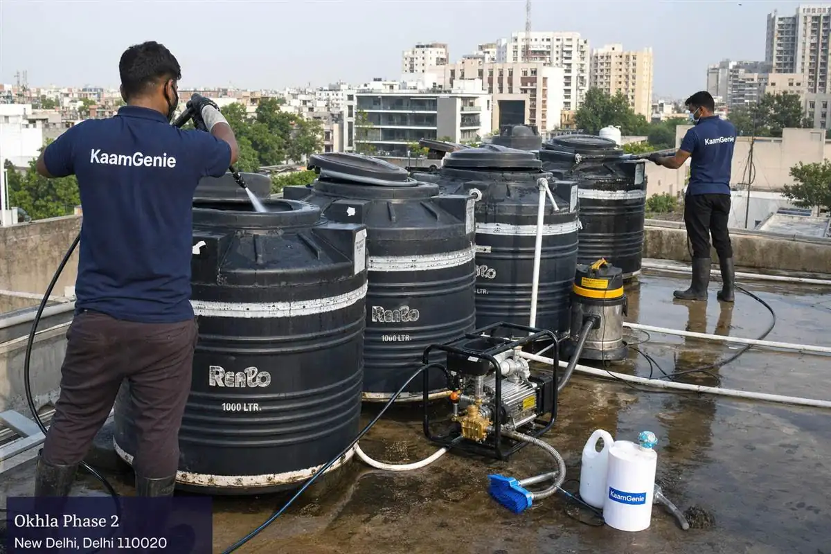 KaamGenie crew cleaning a society water tank in Okhla Phase 2, Delhi