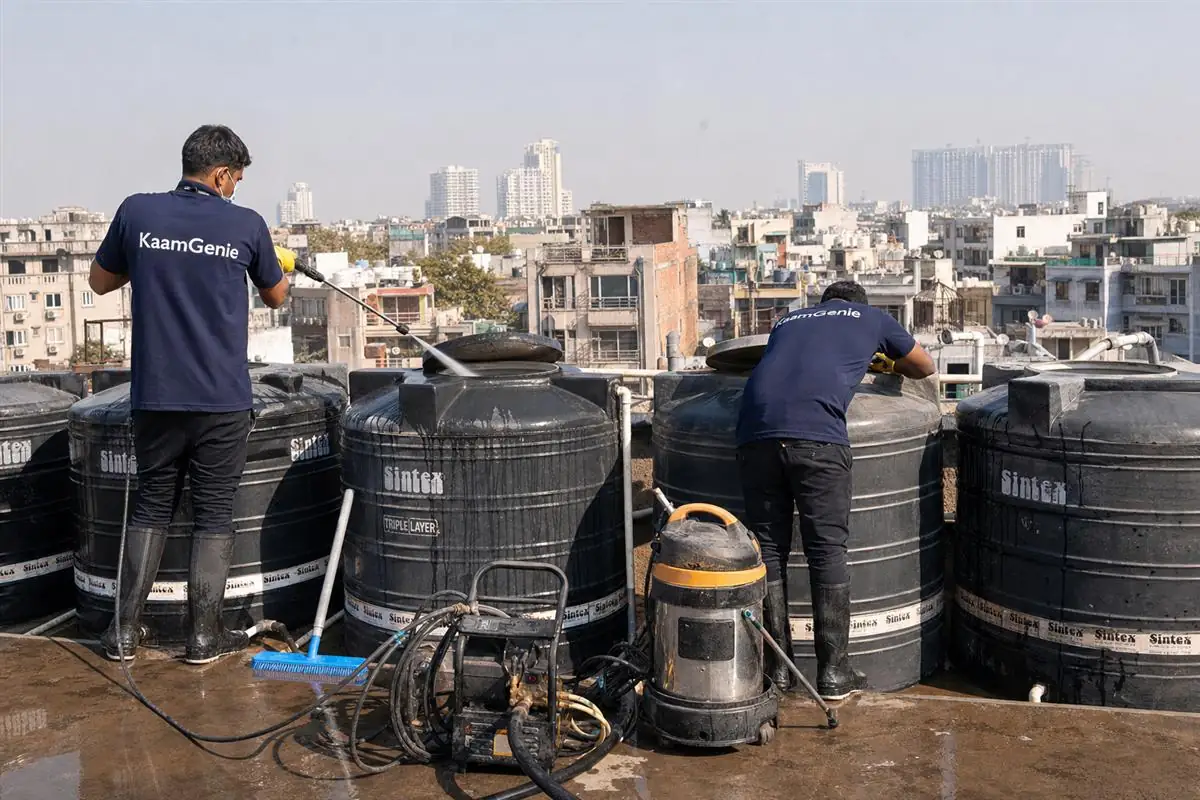 KaamGenie crew cleaning a society water tank in Okhla Phase 3, Delhi