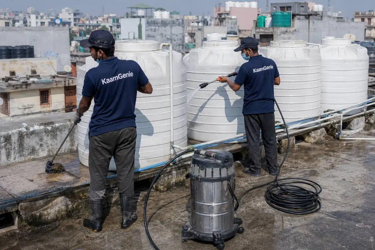 KaamGenie crew cleaning a society water tank in Okhla Vihar, Delhi