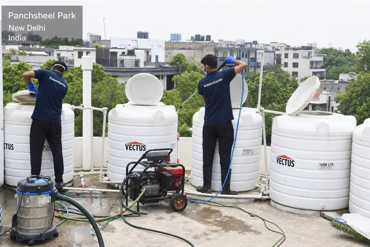 KaamGenie crew cleaning a society water tank in Panchsheel Park, Delhi