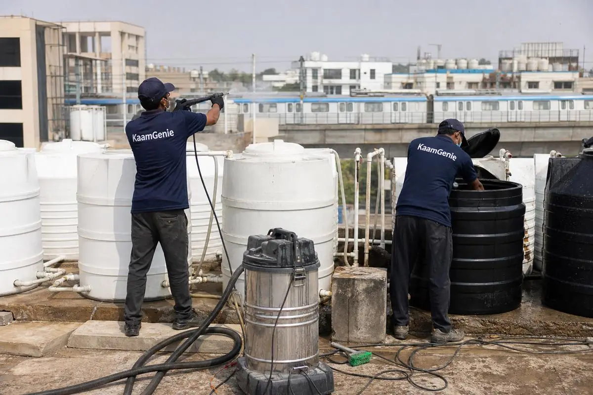 KaamGenie crew cleaning a society water tank in Patel Nagar, Delhi