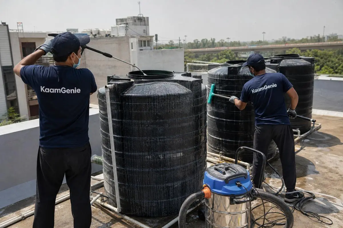 KaamGenie crew cleaning a society water tank in Punjabi Bagh, Delhi