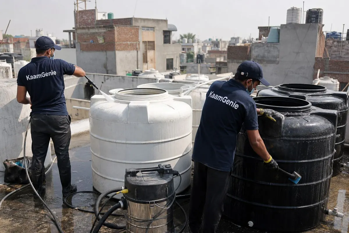 KaamGenie crew cleaning a society water tank in Raghubar Pura, Delhi