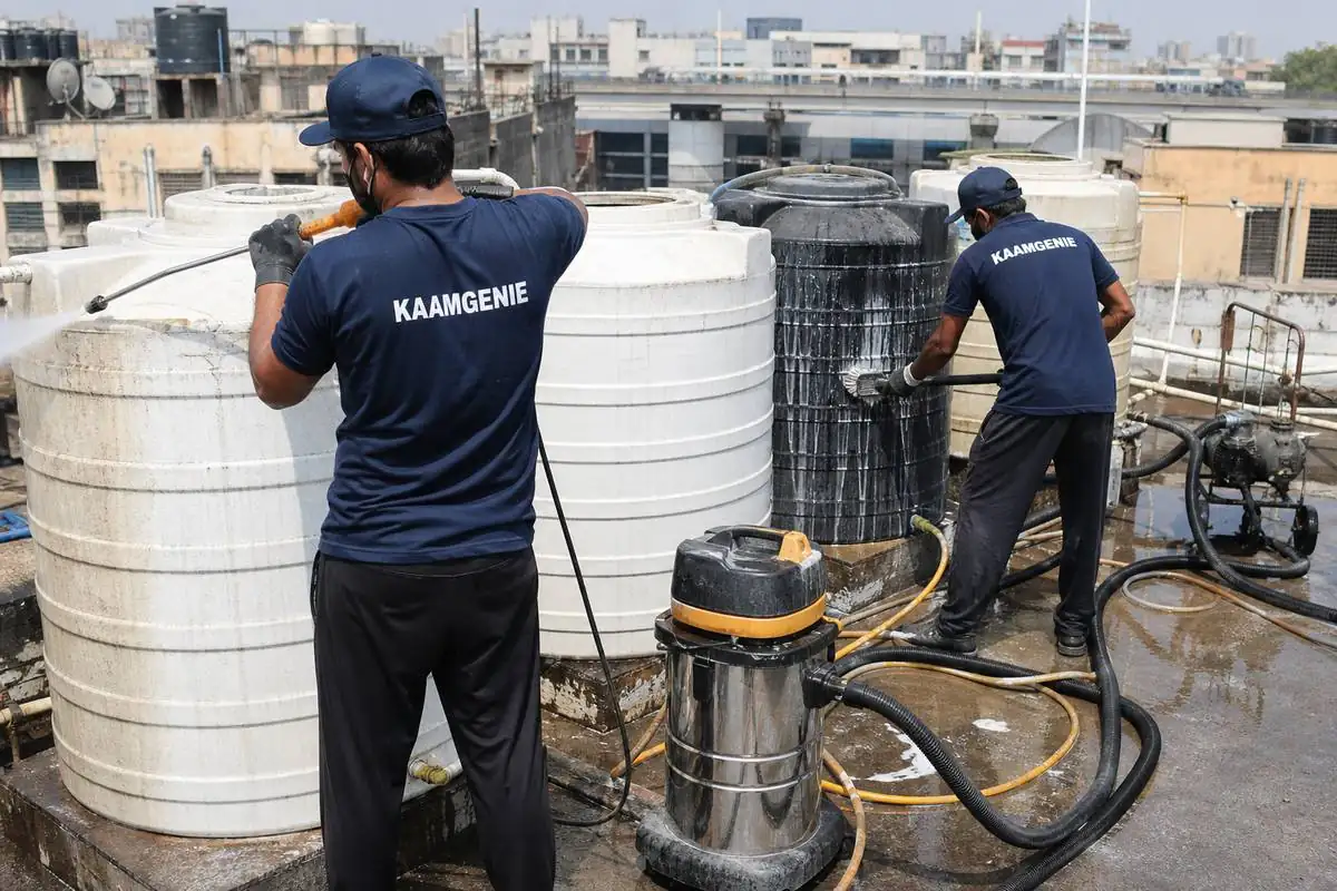 KaamGenie crew cleaning a society water tank in Rajouri Garden, Delhi