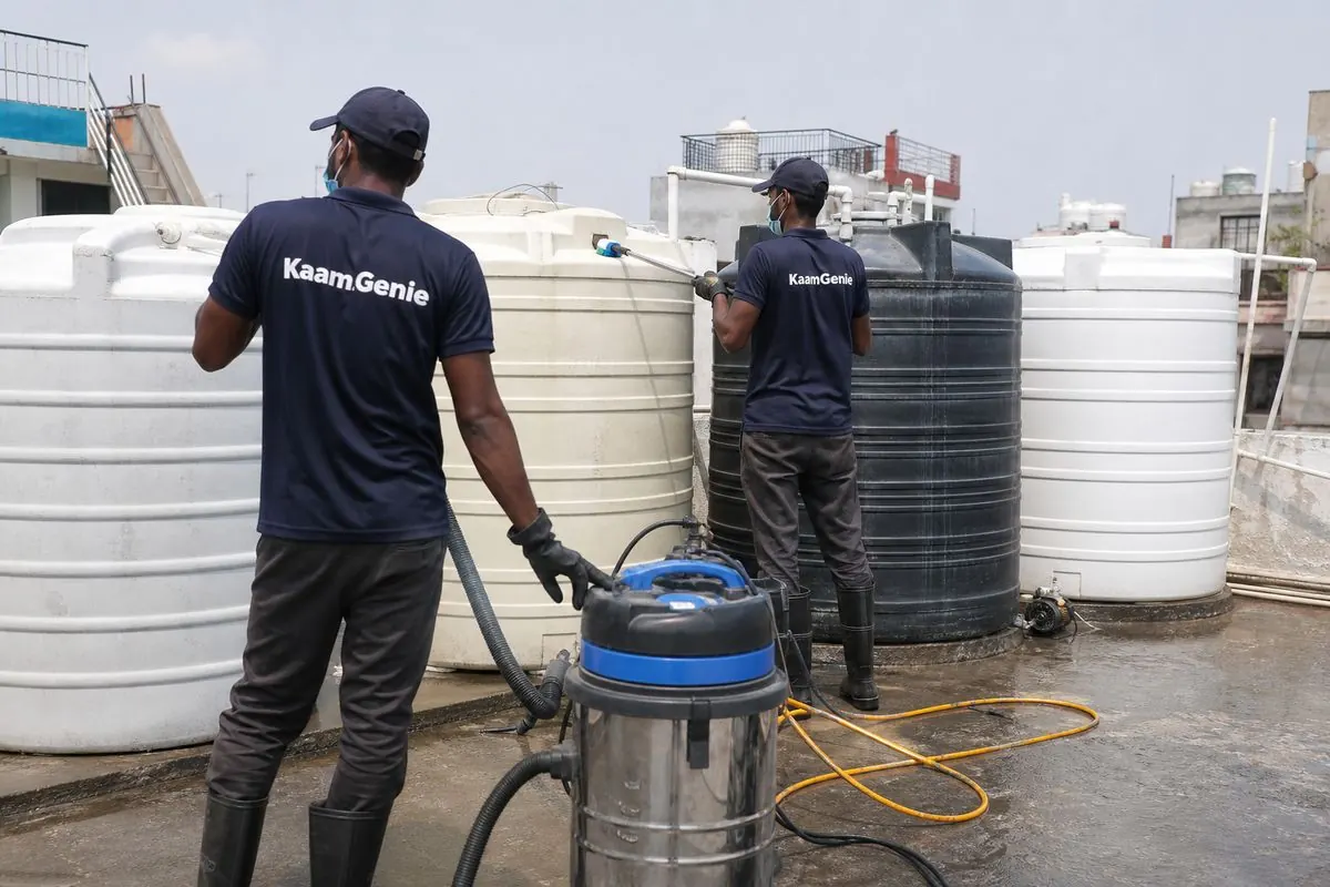 KaamGenie crew cleaning a society water tank in Ramesh Nagar, Delhi