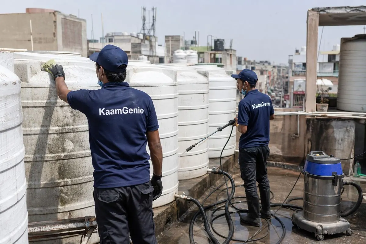 KaamGenie crew cleaning a society water tank in Rani Bagh, Delhi
