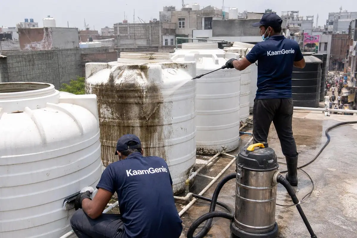 KaamGenie crew cleaning a society water tank in Sadar Bazar, Delhi