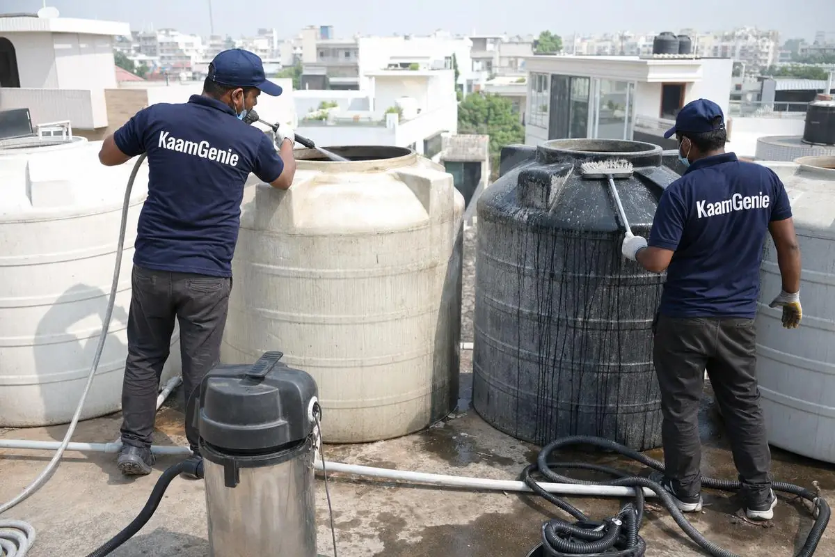 KaamGenie crew cleaning a society water tank in Sainik Farms, Delhi