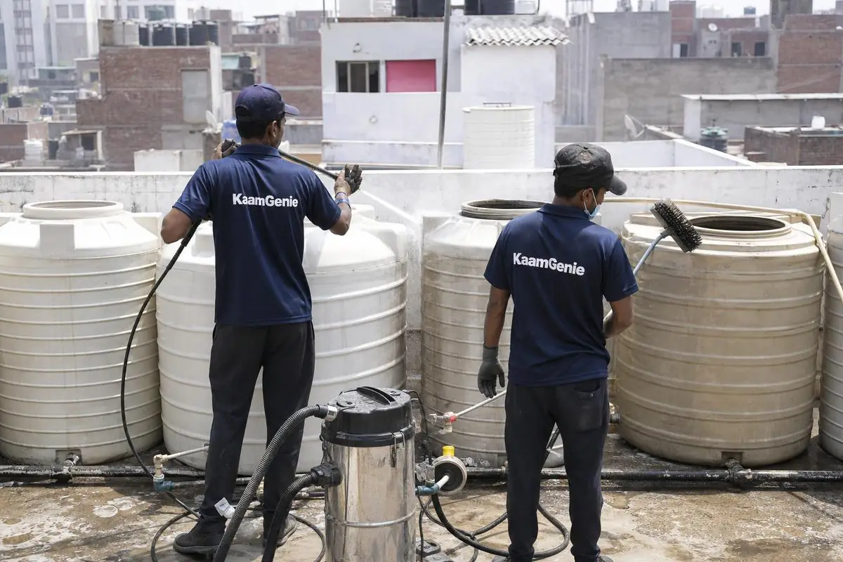KaamGenie crew cleaning a society water tank in Satyawati Nagar, Delhi
