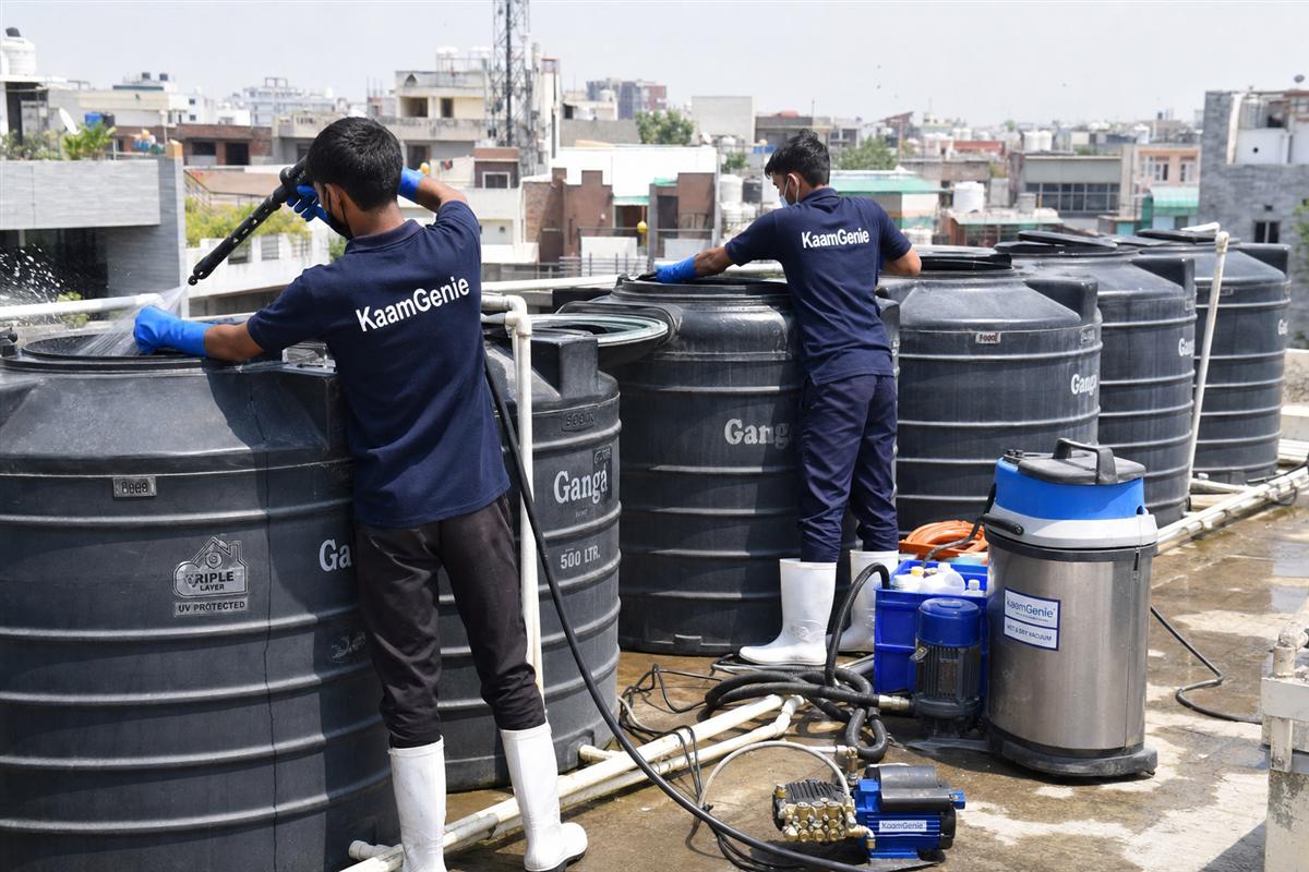 KaamGenie crew cleaning a society water tank in Shahpur Jat, Delhi