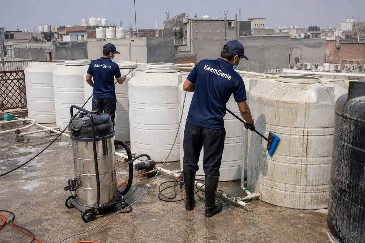 KaamGenie crew cleaning a society water tank in Shiv Vihar, Delhi