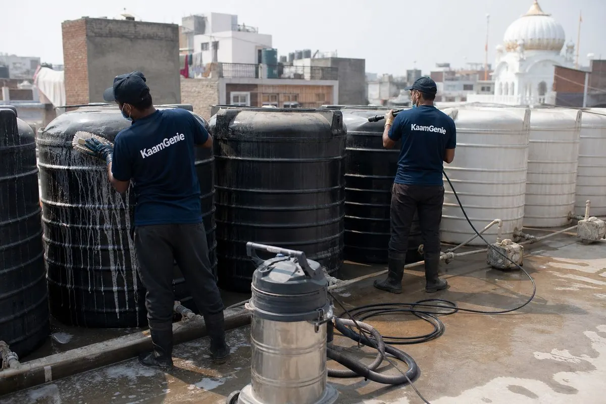 KaamGenie crew cleaning a society water tank in Tilak Nagar, Delhi