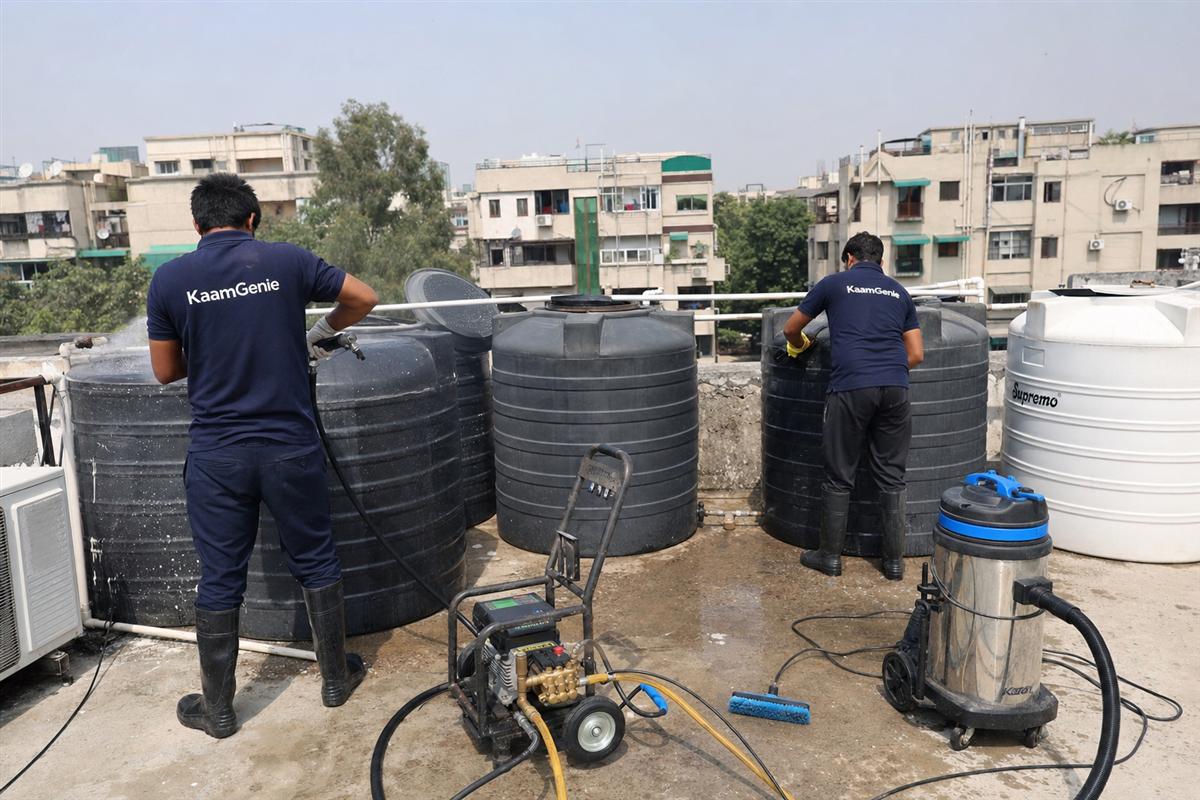 KaamGenie crew cleaning a society water tank in Vasant Kunj, Delhi