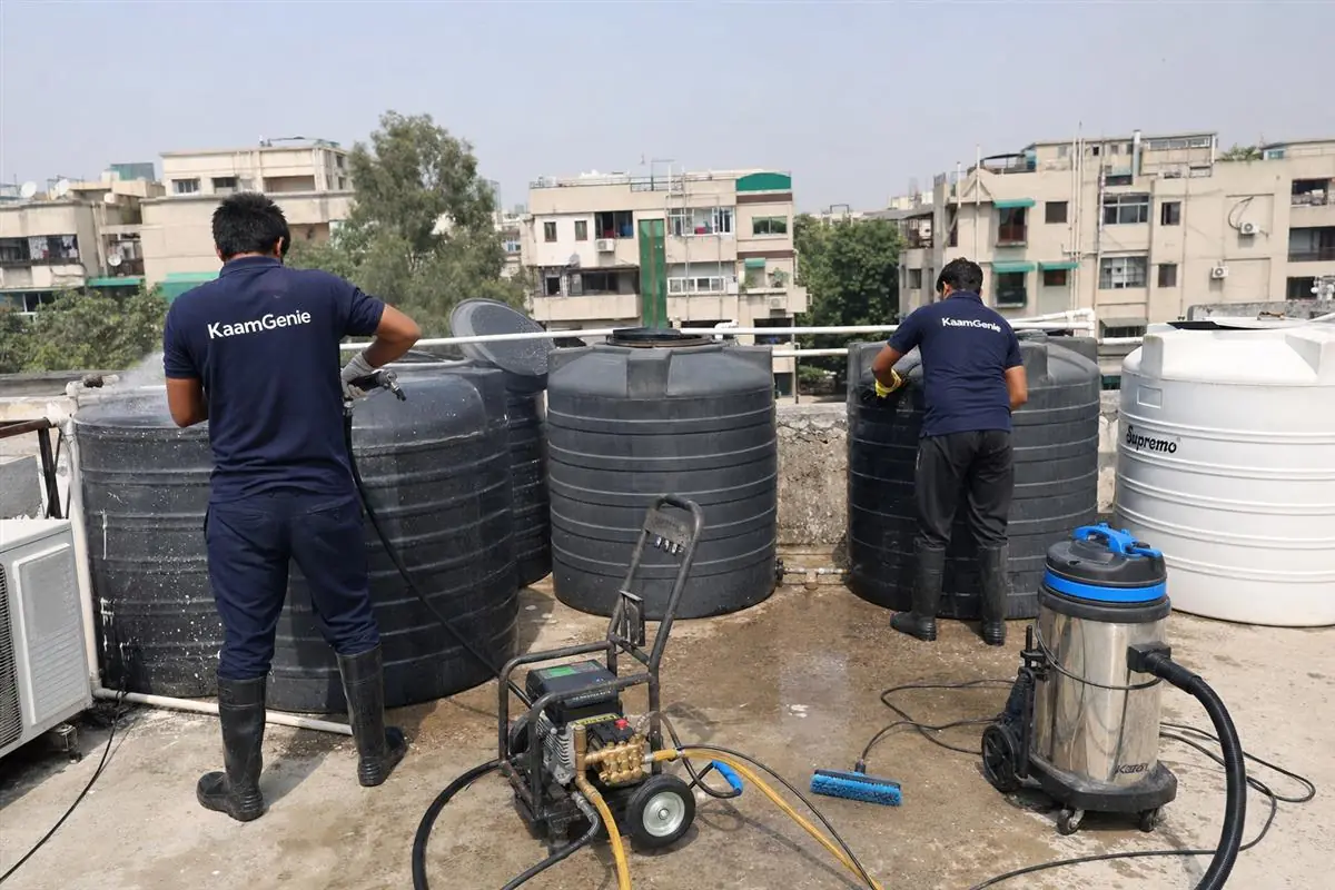 KaamGenie crew cleaning a society water tank in Vasant Kunj, Delhi