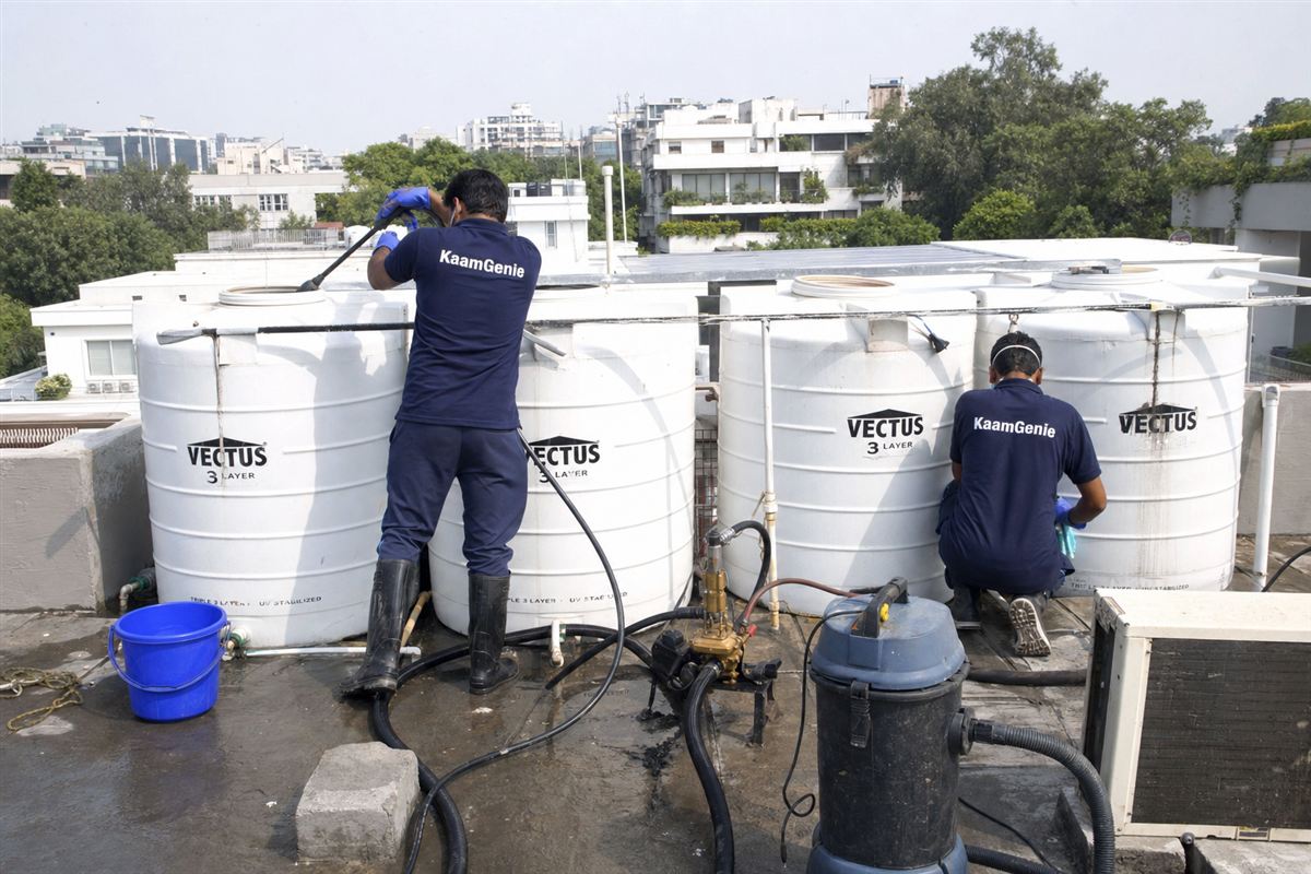 KaamGenie crew cleaning a society water tank in Vasant Vihar, Delhi