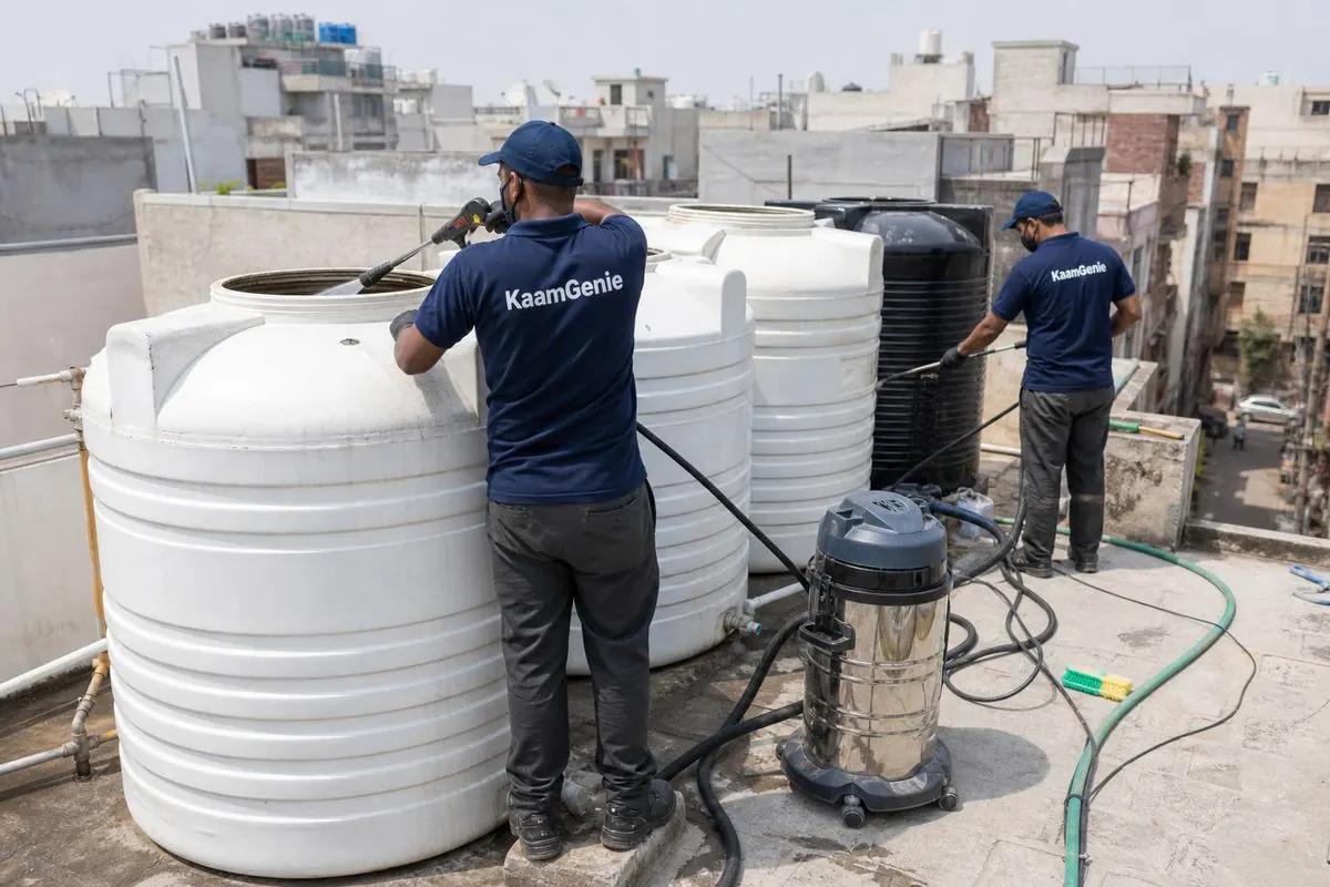 KaamGenie crew cleaning a society water tank in Vinod Nagar, Delhi