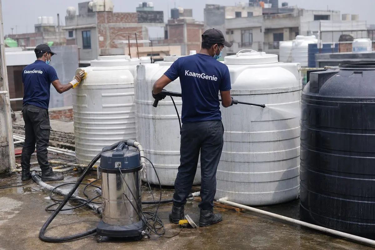 KaamGenie crew cleaning a society water tank in Vishnu Garden, Delhi