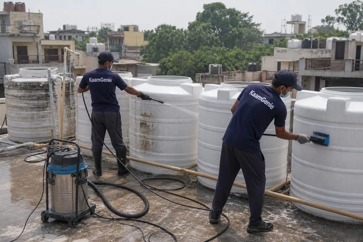 KaamGenie crew cleaning a society water tank in Vivek Vihar, Delhi