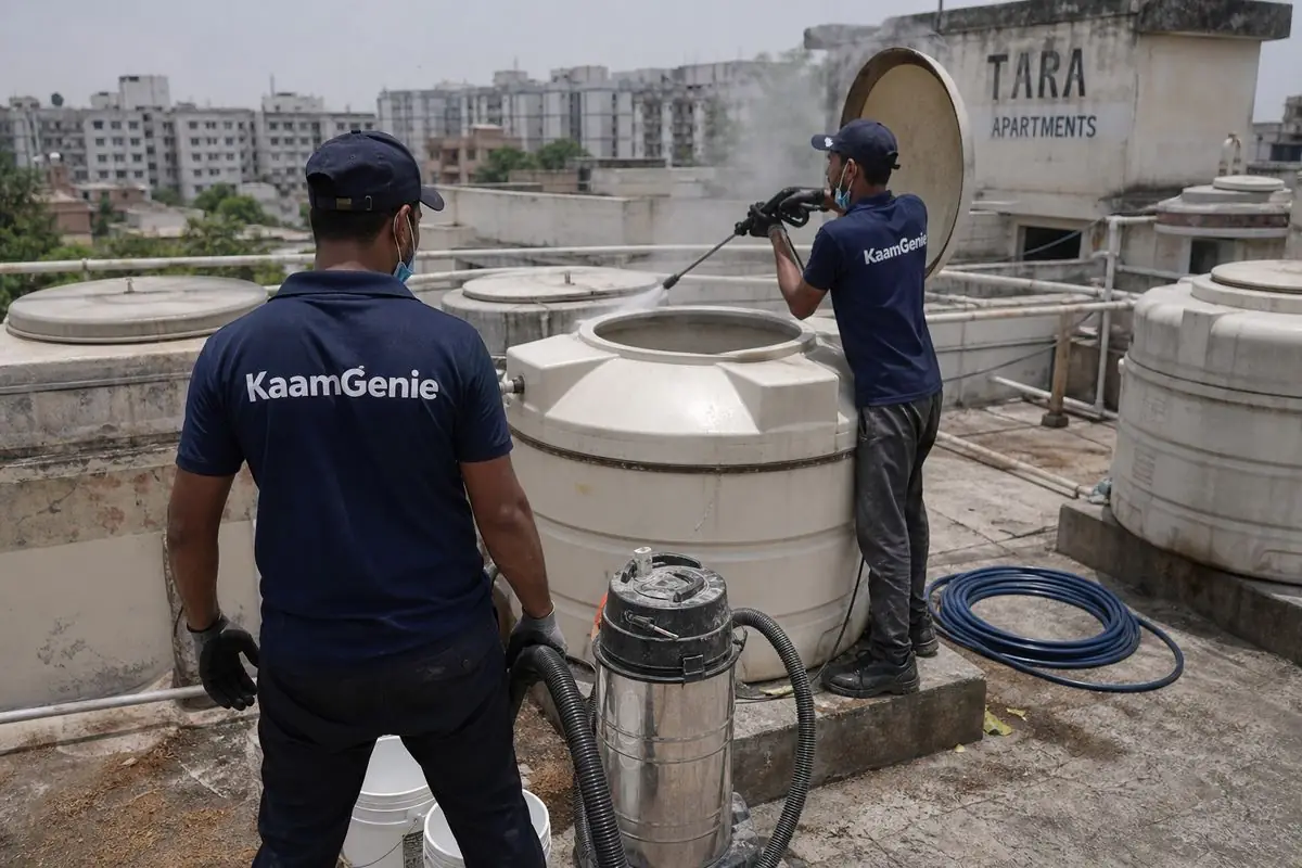 KaamGenie crew cleaning a water tank in Tara Apartments, Delhi