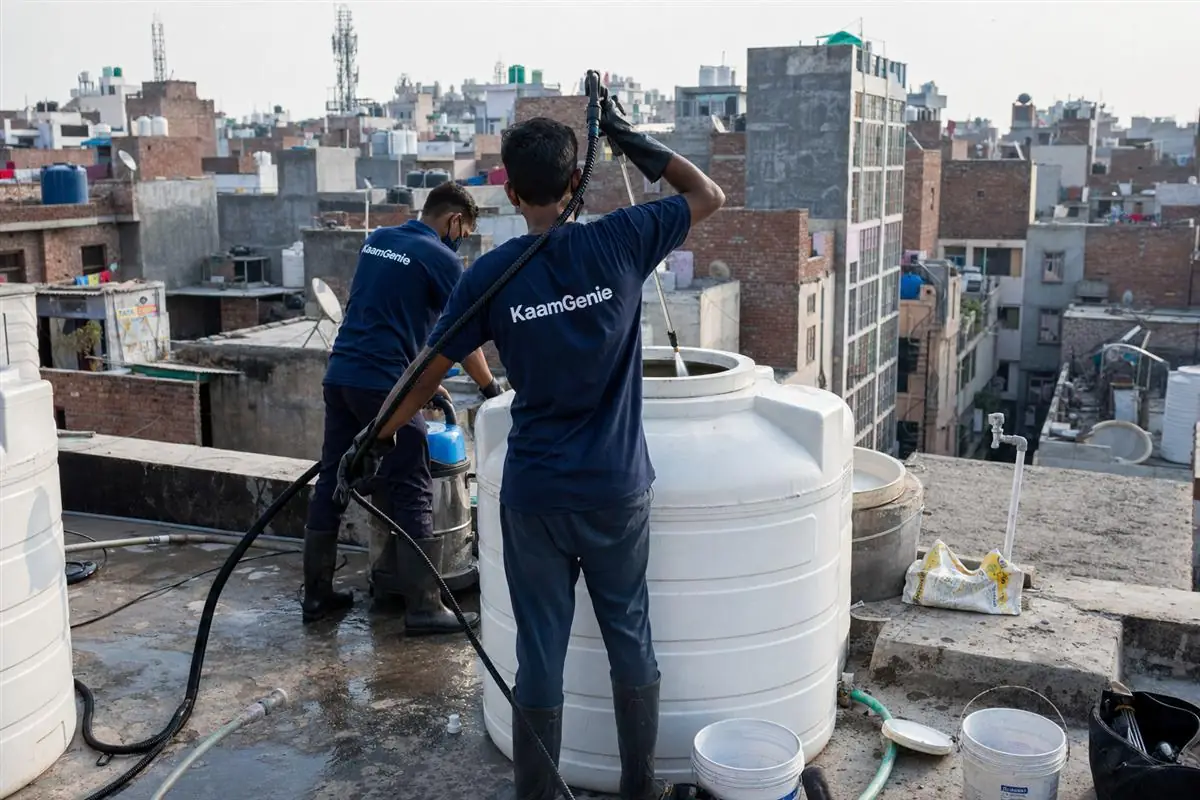KaamGenie crew cleaning a water tank in Tigri, Delhi