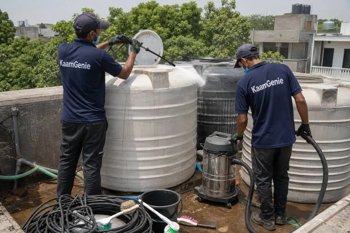 KaamGenie crew cleaning a water tank in Vasant Gaon, Delhi