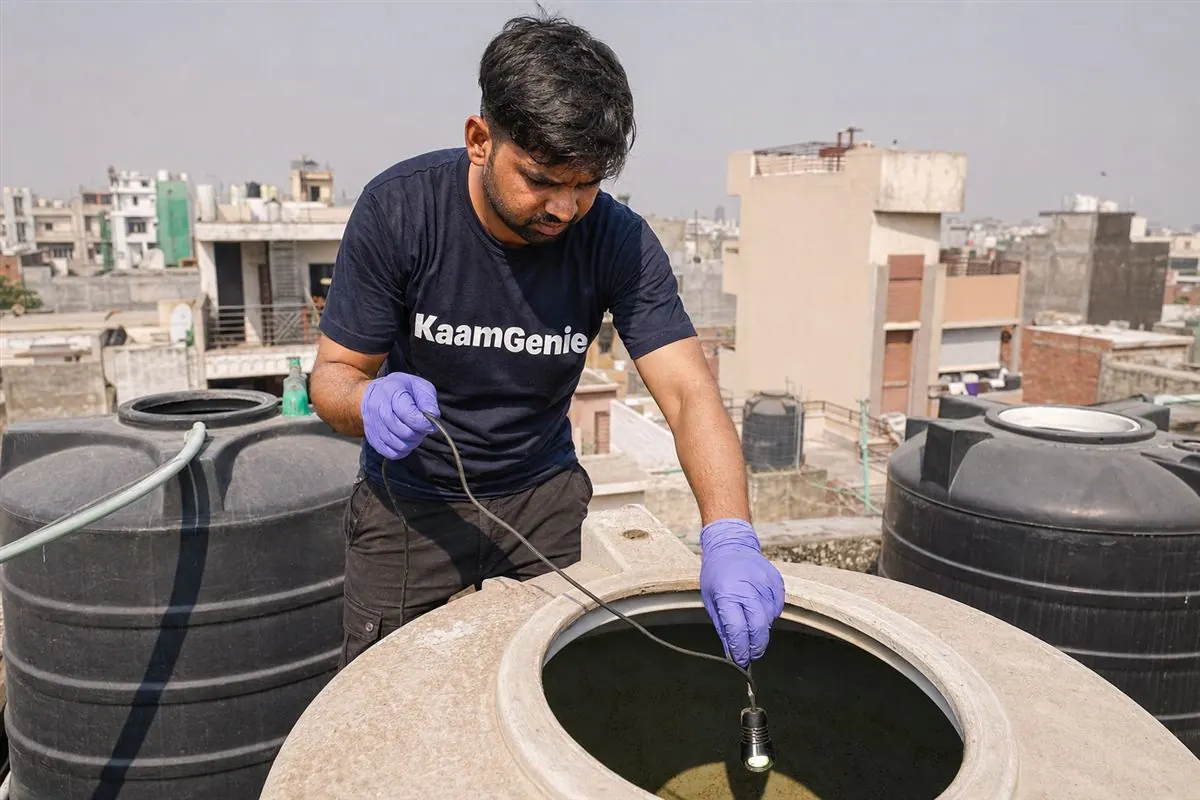 Cross-section view of a neglected Delhi water tank showing a layer of sediment, scale and bio-film at the bottom