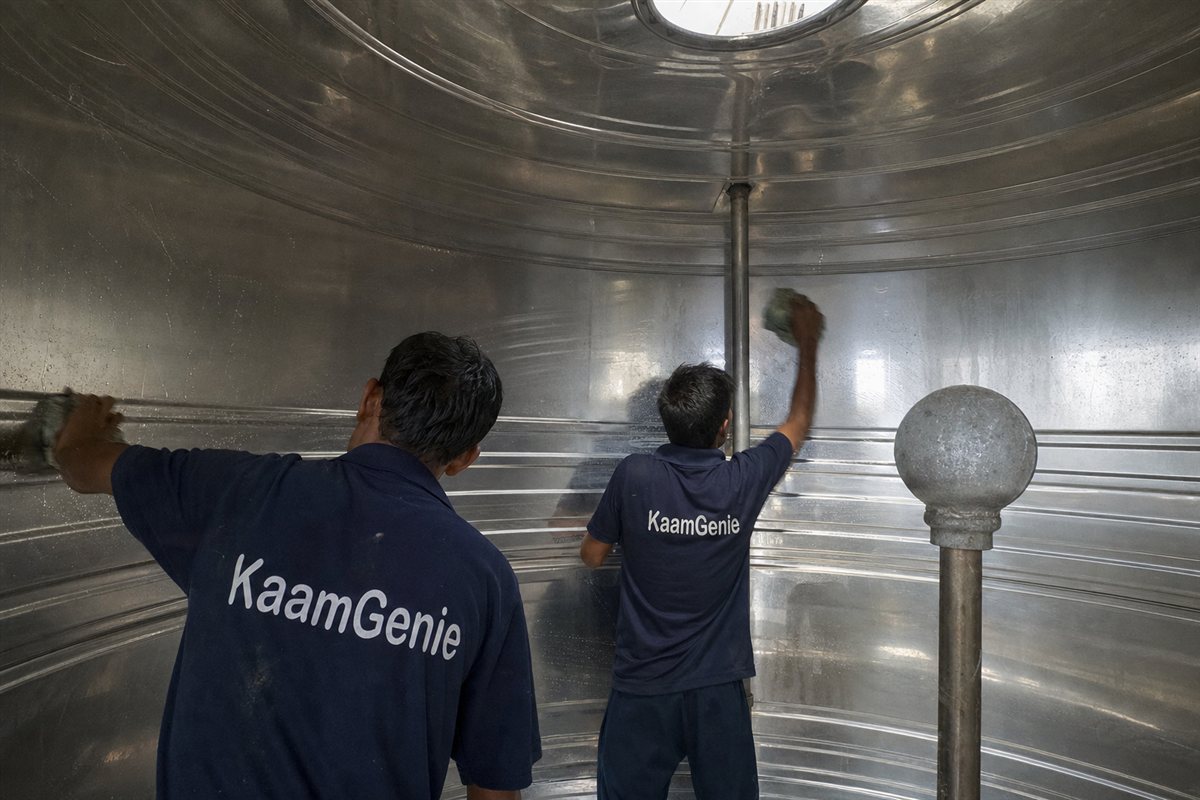A clean, sparkling water tank interior in Noida after full scrubbing and food-grade chlorine disinfection